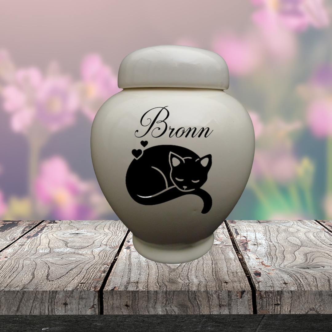 White Treasure Urn with black silhouette of sleeping cat and the name Bronn 